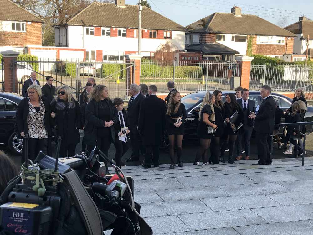 Mourners arrive in Templeogue for the funeral of RTÉ broadcaster Larry Gogan.